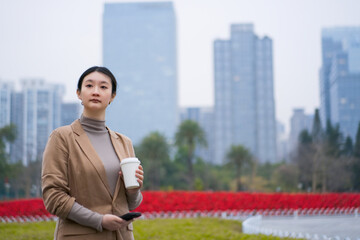 Professional Woman Enjoying Coffee Break in City Park