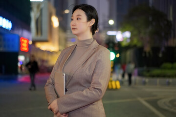 Confident Businesswoman in Urban Evening Setting