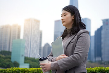 Businesswoman Contemplating Outdoors with Coffee