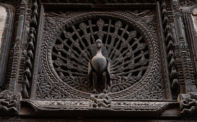 Beautiful peacock window also referred to as the ‘Mona Lisa of Nepal’ adorns the Pujari Math in Bhaktapur, Nepal.