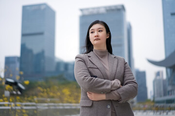 Confident Businesswoman in Urban Setting at Dusk