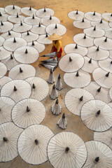 Obraz premium Myanmar people making white umbrellas. Decoration. Lifestyle