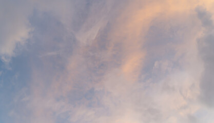 Sunset sky. Abstract nature background. Dramatic blue with orange colorful clouds in twilight time.