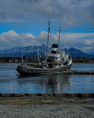 Old boat abandoned in the harbor of Ushuaia