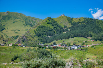 Verdant Oasis: Green Mountains and a Canopy of Blue