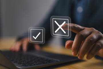 Select the wrong mark on a laptop. check right and wrong marks. concept decide to choose vote. yes...