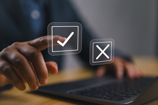 Select the check mark on a laptop. check right and wrong marks. concept decide to choose vote. yes or no decisions, and business options for difficult situations in dilemma.