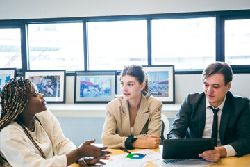 Professional diverse business people having collaboration team meeting in an office, technology and workers, men or employees with touchscreen planning sales, research or financial strategy in company