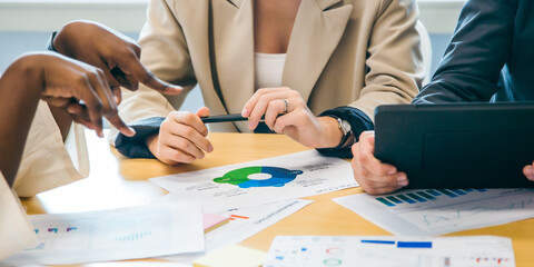 Group of marketing professionals having a meeting. Creative business team brainstorming with sticky notes. Happy business people putting their ideas together as they plan a project.