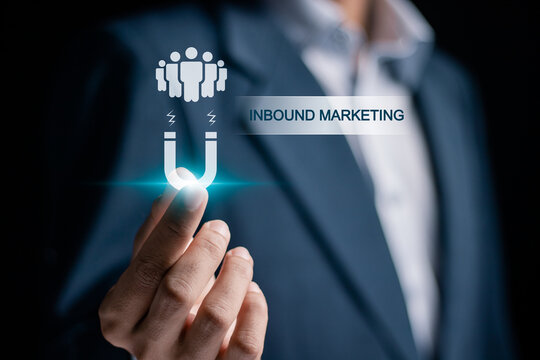 Inbound marketing strategy concept. Creating attraction for customer groups. Businessman holding inbound marketing icon on virtual screen.