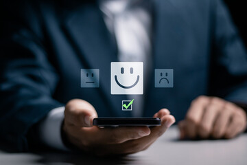 Customer satisfaction survey concept. Businessman use smartphone to give excellent five-star...