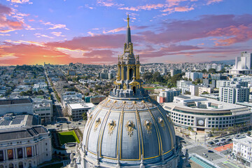 a stunning aerial shot of San Francisco City Hall surrounded by office buildings, apartments, lush...