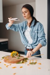 Fresh and Healthy: Young Caucasian Woman Preparing Vegetarian Salad in Modern Kitchen