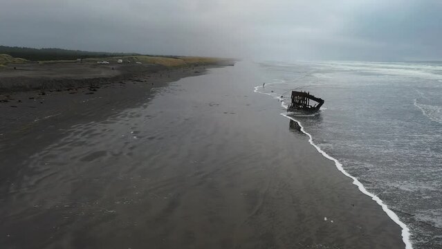 Famous Peter Iredale shipwreck in Fort Stevens State Park, Oregon aerial drone video footage