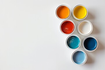 a few containers of paint on a white background with copyspace