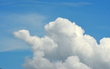 photo of white clouds and clear blue sky in summer