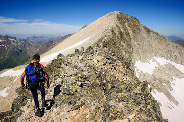 Fototapeta premium Ascent to Perdiguero peak (3170m.).Pirineos.Huesca.Pyrenean mountain range.Catalunya.Spain.