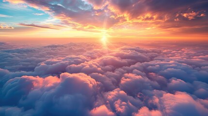 Beautiful sunset sky above the clouds with stunning light. - obrazy, fototapety, plakaty