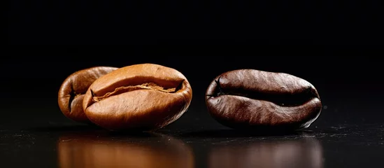 Zelfklevend Fotobehang Rich Aroma: Coffee Beans Scattered on a Dark Background with Copy Space © Ilgun
