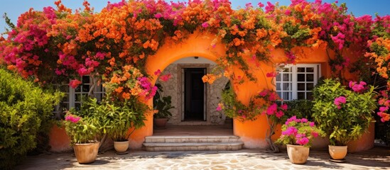 Fototapeta na wymiar Quaint Cottage with Vibrant Blooms Adorning the Entrance in a Picturesque Setting
