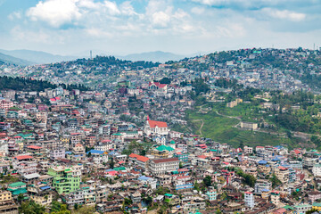 Fototapeta na wymiar Cityscape with buildings and homes along the hillside in Kohima, Nagaland, India