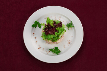 Salad on a white plate, menu for a restaurant