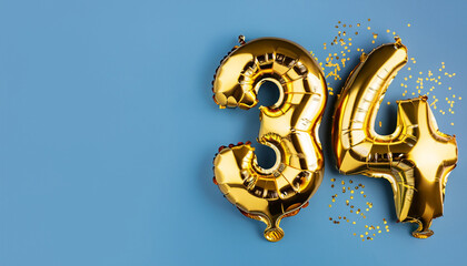 Banner with number 34 golden balloon with copy space. thirty four years anniversary celebration concept on a blue background.