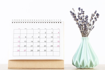 Calendar page with lavender flowers on white background