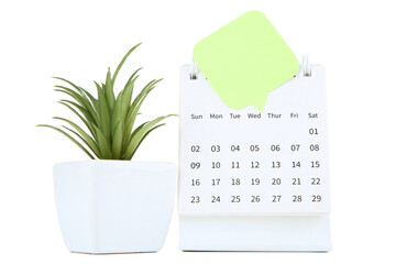 Calendar page with speech bubble and green plant on white background - 760328087