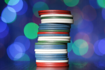 Poker chips on blurred bokeh background - 760328494