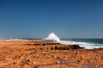 Experience the mesmerizing Point Quobba Blowholes in WA! Witness nature's spectacle as waves crash...