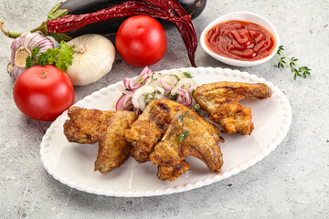 Grilled chicken wings with sauce