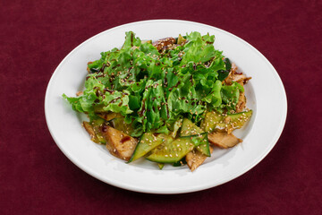 Salad on a white plate, menu for a restaurant