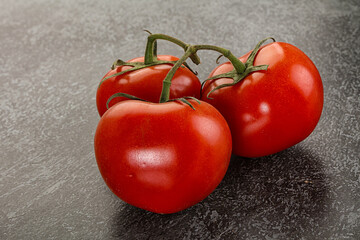Sweet ripe tomatoes on the branch