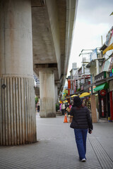 Girl walking in Shilin Market, Taipei, Taiwan