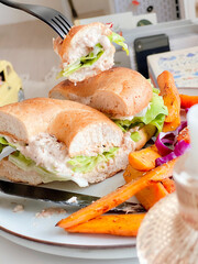  Tuna Bagel with mixed salads for breakfast. Morning time. Fresh meal.Delicious food. Cooking recipes. Brunch. Healthy recipe. American bagel breakfast.