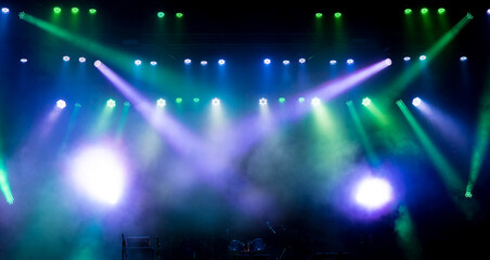 Stage light with colored spotlights and smoke.
