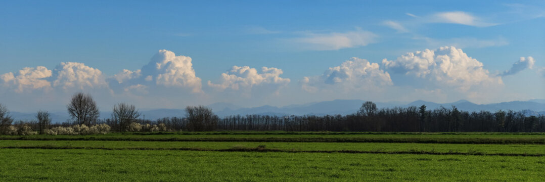 Po Valley landscape fields sky clouds characteristic