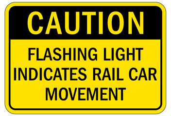 Railroad safety sign flashing light indicates rail car movement