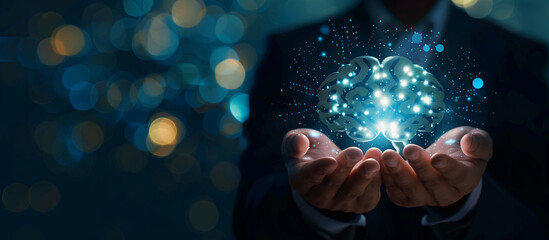 Businessman holding a brain icon and glowing light effect on a dark blue background