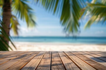 Wooden table with blurred bokeh light seascape and palm leaves at tropical beach background