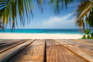 Wooden table with blurred bokeh light seascape and palm leaves at tropical beach background