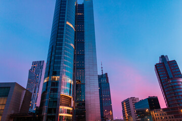 Beautiful modern city of Warsaw with office and business buildings on an amazing evening sunset sky...