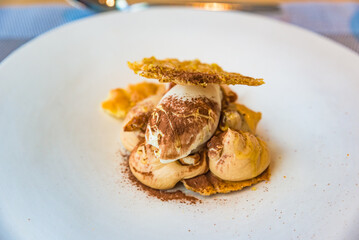 Praline cream puff caramelized hazelnuts chestnut blossom honey, Italian cuisine