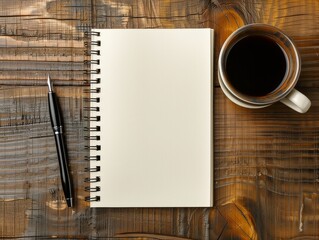 An empty notebook with a pen on a wooden surface next to a cup of black coffee.