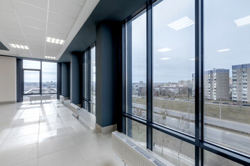 panorama view in empty modern hall with columns, doors , stairs and panoramic windows.