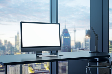 Fototapeta premium Contemporary office interior with empty white computer monitor on desk and panoramic windows with beautiful city view and daylight. Mock up. Workplace concept. 3D Rendering.