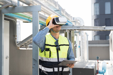 Male engineer using virtual reality headset inspecting quality of water pipes system at rooftop of building. Male plumber wearing virtual reality headset for inspecting water pipes network system