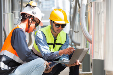 Group of male plumber engineer working and inspecting quality of water pipes system at building...