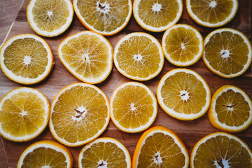 Juicy fresh orange slices on a wooden chopping board